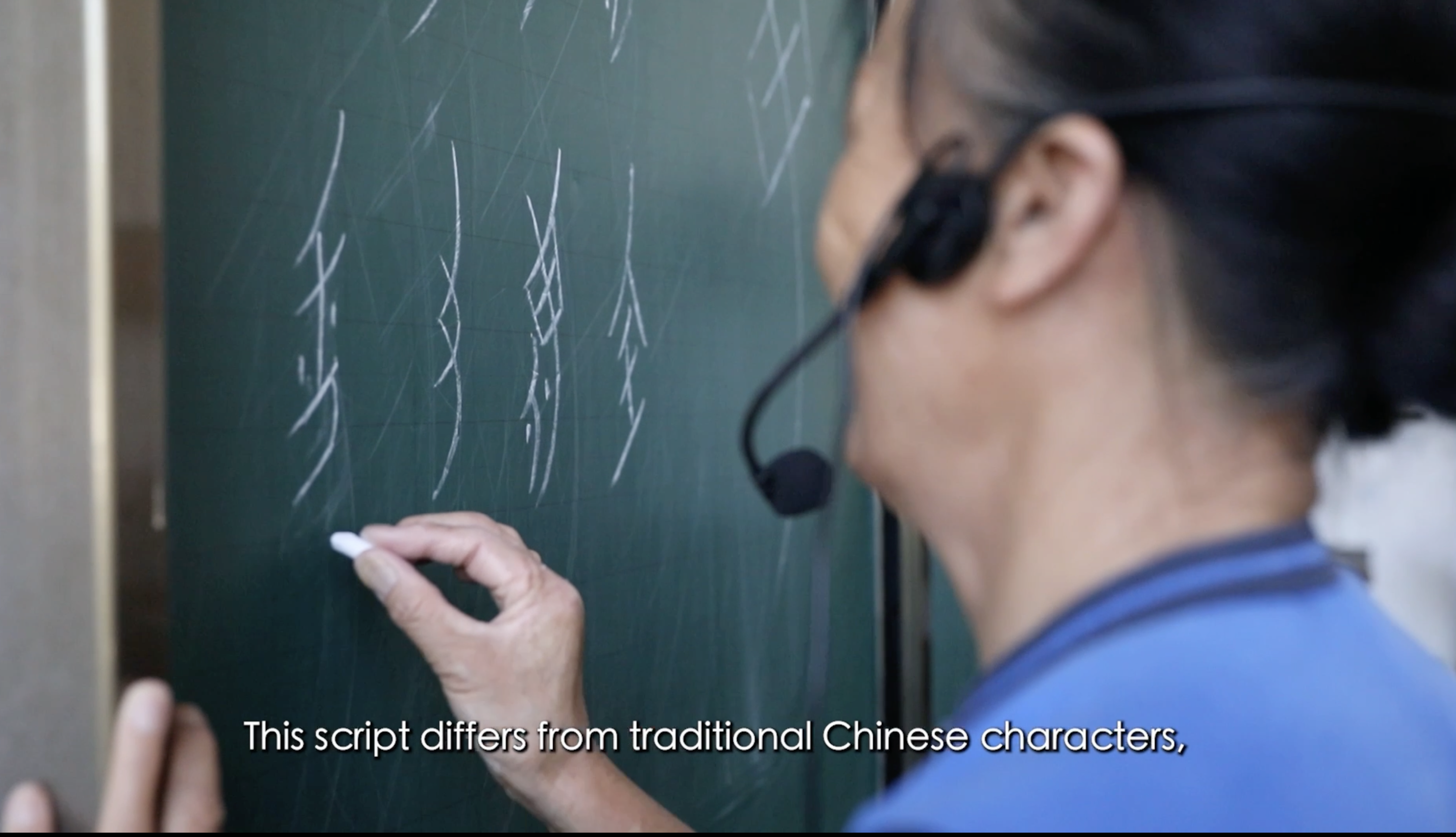 Her Voice Documentary Still. Picture of woman writing.